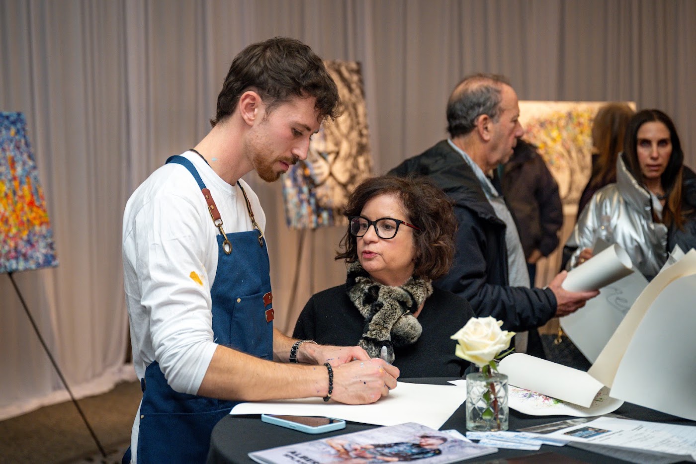 Albert Levi signing for a guest